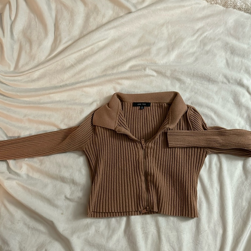 A cute collared long sleeve with a zipper in the front.